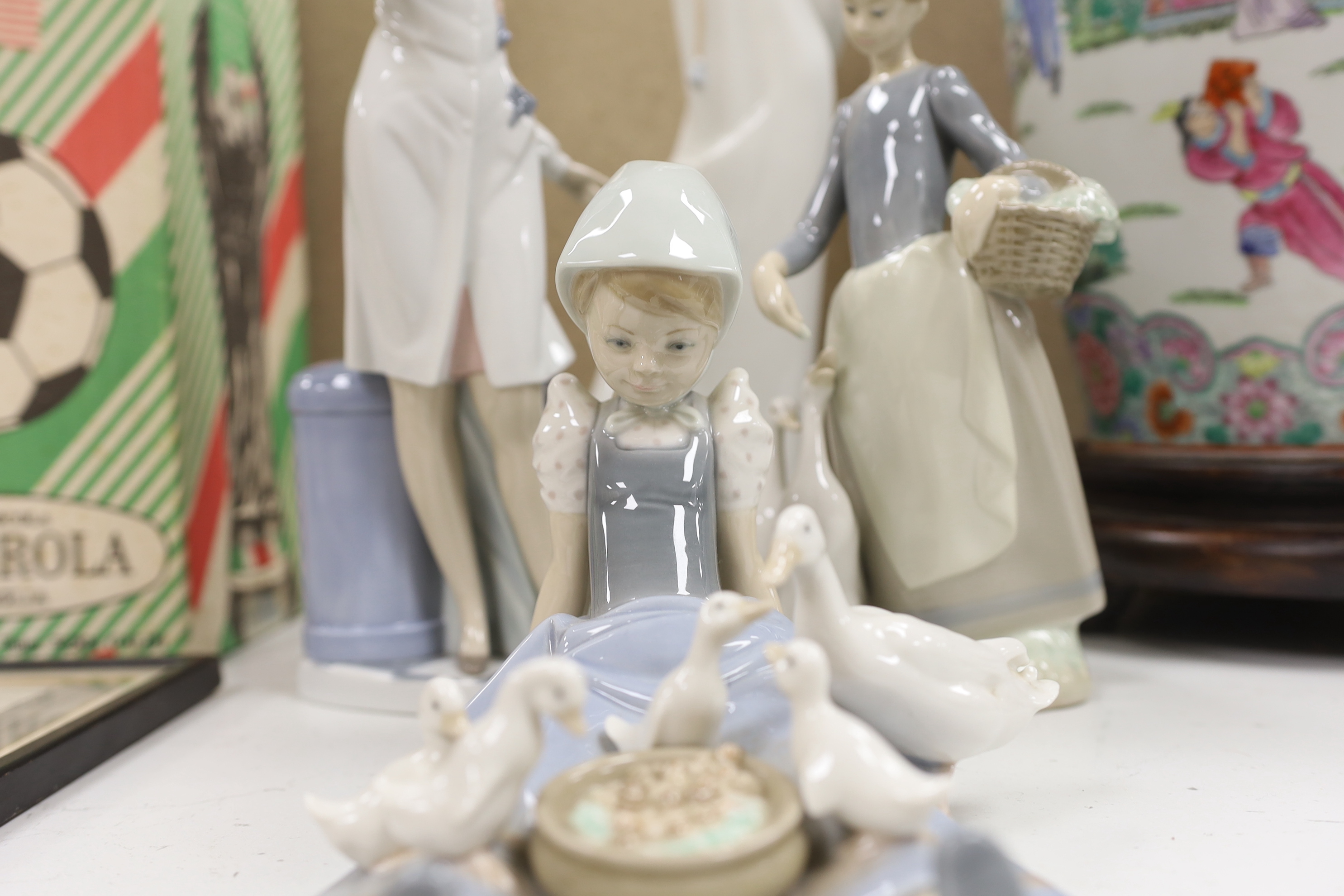 A group of four LLadro figures, tallest 41cm